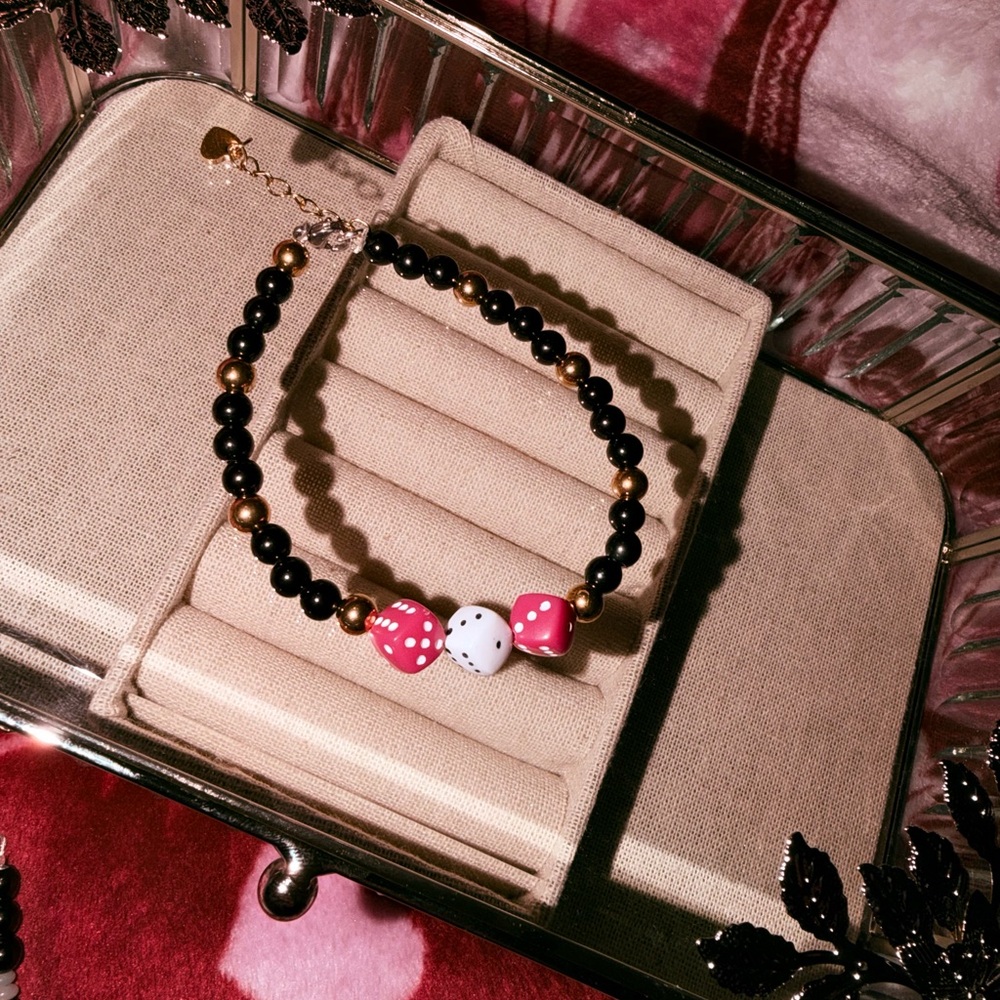Pretty lucky Black and Gold Beaded bracelet with Pink and White Dice